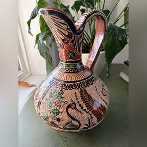Handcrafted Ceramic Pitcher with Intricate Patterns